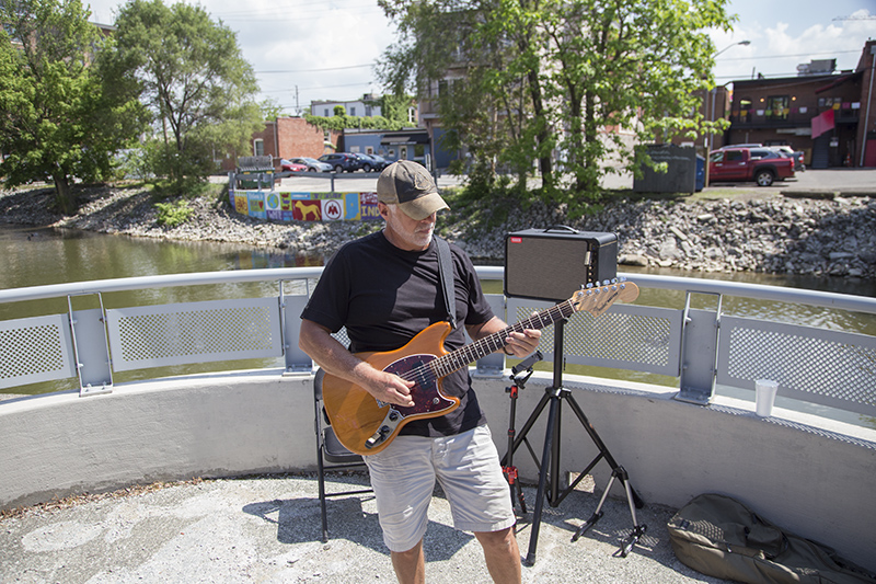 Musician Brian Wheat performed along the Canal