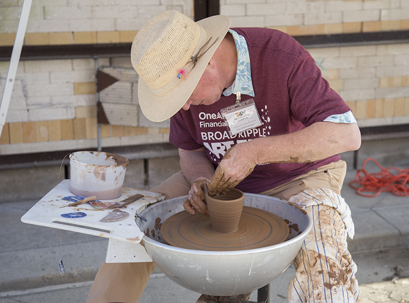 A pottery demonstration on the east end of the Center